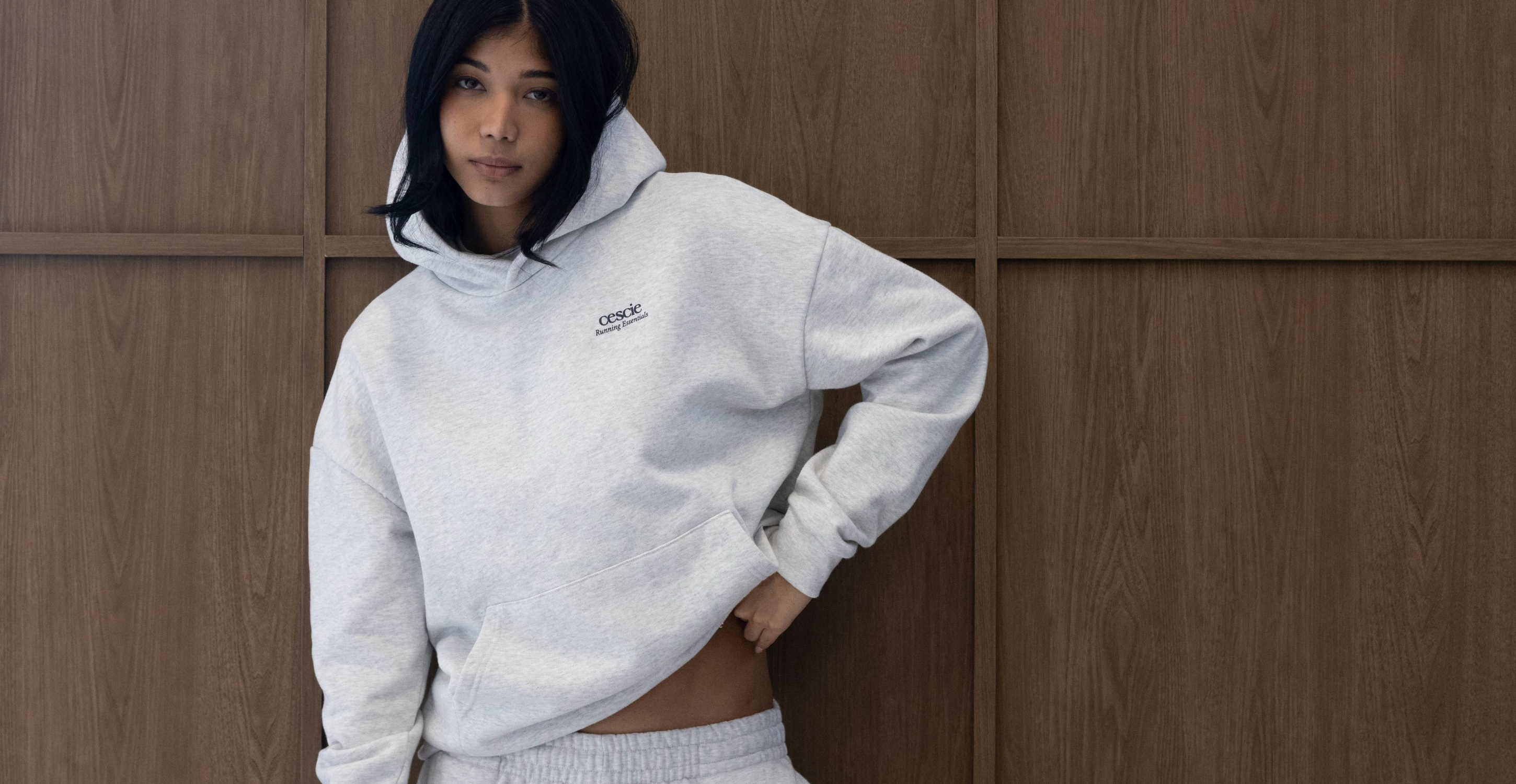 Model wearing cescie essentials grey marl hoodie and joggers
