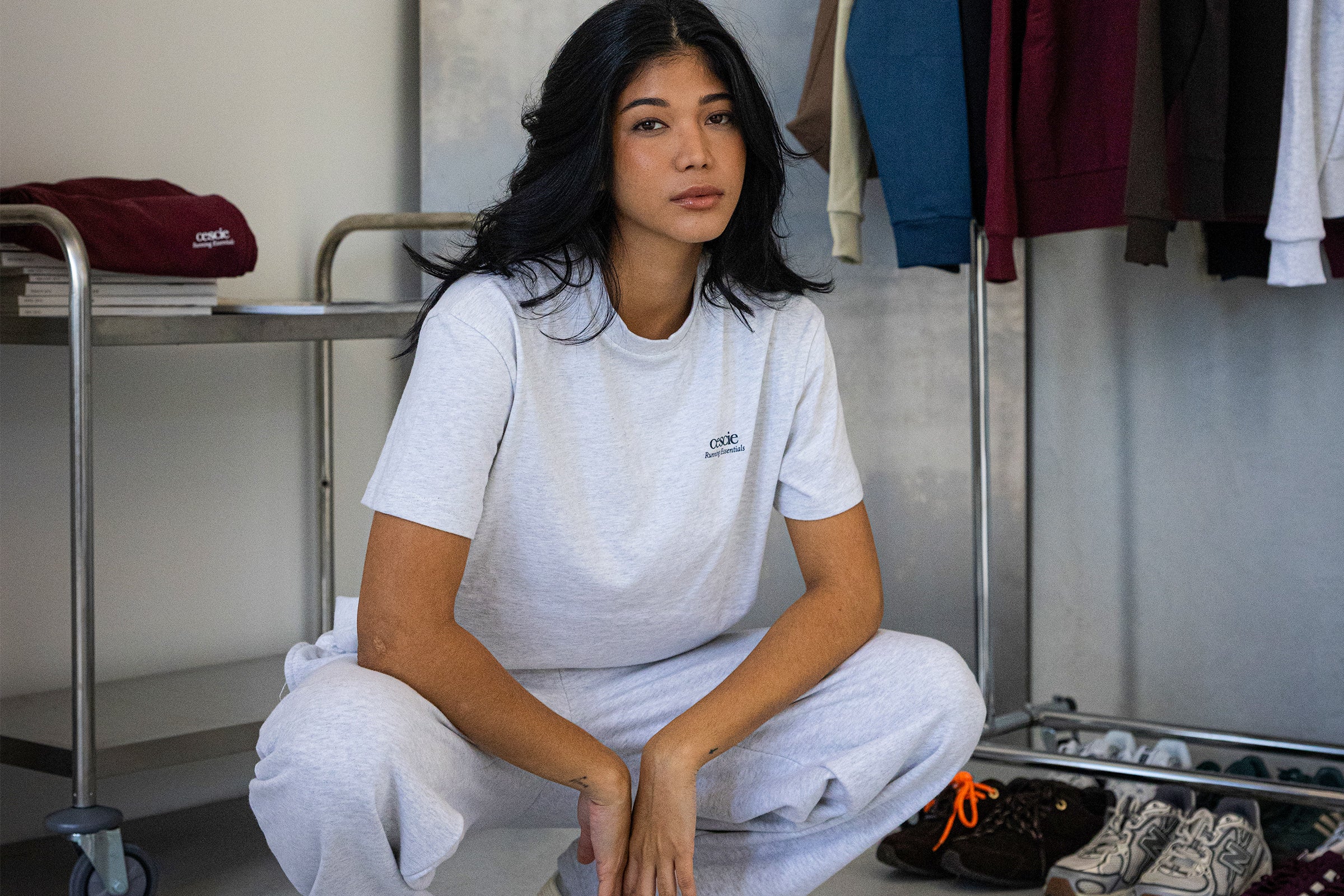 Model wearing light grey cescie essentials t-shirt and joggers